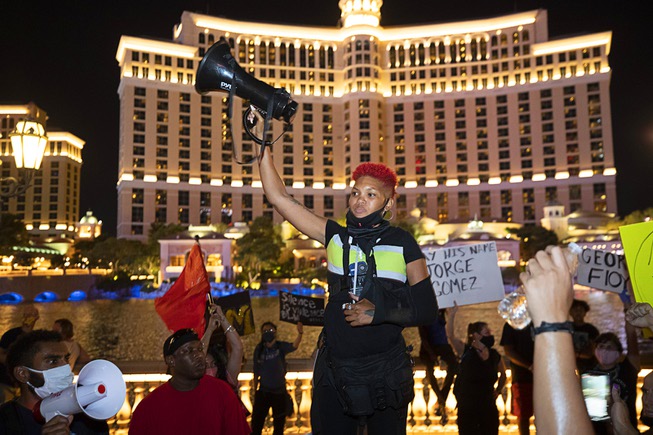 Organizer Zyera Dorsey holds up her megaphone as a protest ...