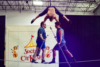 From left, Paul Lopez, Roman Mokrenko and Paul Resell practice a high wire routine at Las Vegas Circus Center, Wednesday, July 29, 2020.