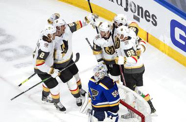 St. Louis Blues goalie Jordan Binnington (50) looks on as the Vegas Golden Knights celebrate a goal during second-period NHL hockey playoff game action in Edmonton, Alberta, Thursday, Aug. 6, 2020. 


