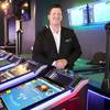 Rob Bone, vice president of tables, utilities & electronic table games at Scientific Games, poses by electronic table games in the company's showroom Thursday, Aug. 6, 2020.