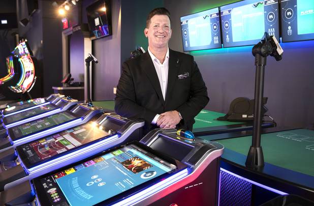 Rob Bone, vice president of tables, utilities & electronic table games at Scientific Games, poses by electronic table games in the company's showroom Thursday, Aug. 6, 2020.