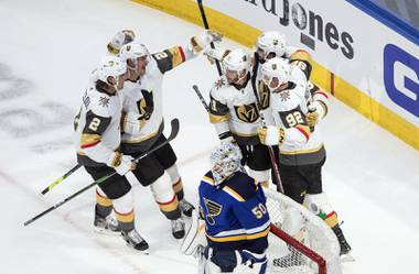 St. Louis Blues goalie Jordan Binnington (50) looks on as the Vegas Golden Knights celebrate a goal during second-period NHL hockey playoff game action in Edmonton, Alberta, Thursday, Aug. 6, 2020. (Jason Franson/The Canadian Press via AP)