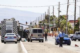 Investigators work a crime scene near North Nellis Blvd and Las Vegas Blvd North, Monday, Aug. 10, 2020.