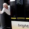 In this April 4, 2019, file photo Richard Branson, of Virgin Group, waves as he arrives on a Brightline train in West Palm Beach, Fla.