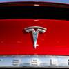 In this Feb. 2, 2020, file photo, the company logo appears on an unsold 2020 Model X at a Tesla dealership in Littleton, Colo.