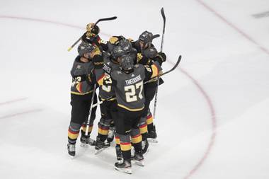 Vegas Golden Knights celebrate a goal against the Chicago Blackhawks during the second period in Game 1 of an NHL hockey Stanley Cup first-round playoff series, Tuesday, Aug. 11, 2020, in Edmonton, Alberta. (Jason Franson/The Canadian Press via AP)