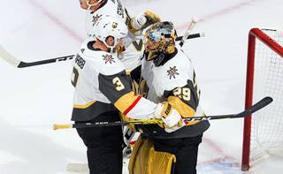 Vegas Golden Knights' Brayden McNabb (3) and goalie Marc-Andre Fleury (29) celebrate the win over the Chicago Blackhawks in an NHL hockey Stanley Cup first-round playoff series, Saturday, Aug. 15, 2020, in Edmonton, Alberta.