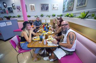 A group has lunch during the final day of Vickie's Diner in the White Cross Market on the Las Vegas Strip Sunday, Aug. 16, 2020. The diner, one of the oldest in Las Vegas, is planning to reopen in another location.