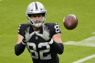 Las Vegas Raiders tight end Jason Witten (82) catches a ball during an NFL football training camp practice Friday, Aug. 21, 2020, in Las Vegas. (AP Photo/John Locher)