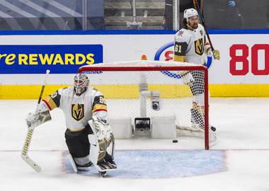 Vegas Golden Knights goalie Robin Lehner and teammate Mark Stone react after the Vancouver Canucks scored during the third period in Game 6 of an NHL hockey second-round playoff series in Edmonton, Alberta, Thursday, Sept. 3, 2020. 