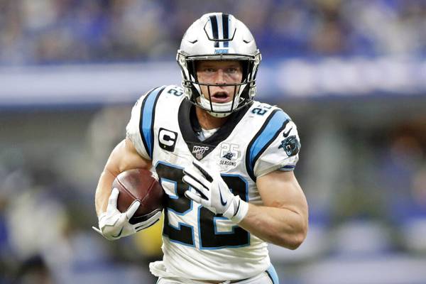 Carolina Panthers running back Christian McCaffrey (22) is tackled by Las  Vegas Raiders safety …