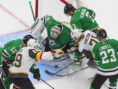 Dallas Stars goalie Anton Khudobin (35) makes a save on Vegas Golden Knights’ William Karlsson (71) during the first period of Game 3 of the NHL hockey Western Conference final, Thursday, Sept. 10, 2020, in Edmonton, Alberta.