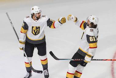 Vegas Golden Knights’ Shea Theodore, left, celebrates his goal against the Dallas Stars with Mark Stone (61) during the third period of Game 3 of the NHL hockey Western Conference final, Thursday, Sept. 10, 2020, in Edmonton, Alberta.