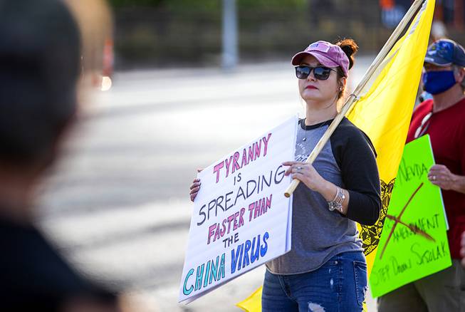 Valarie Mullins protests on Washington Avenue near the Sawyer State ...