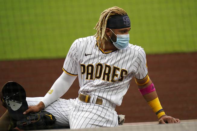 San Diego Padres shortstop Fernando Tatis Jr. wears a mask after hearing that the team's baseball game against the San Francisco Giants had been postponed, Friday, Sept. 11, 2020, in San Diego, minutes before the scheduled first pitch. 

