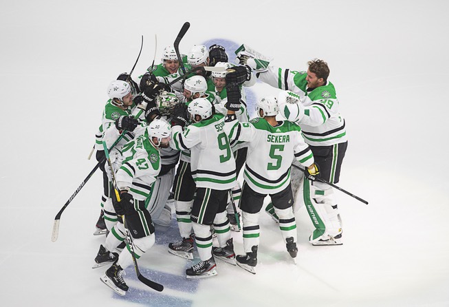 Dallas Stars players celebrate their overtime win over the Vegas ...