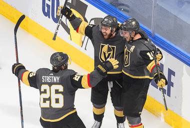 Vegas Golden Knights’ Reilly Smith (19) celebrates his goal against the Dallas Stars with Paul Stastny (26) and Jonathan Marchessault (81) during third-period NHL Western Conference final playoff game action in Edmonton, Alberta, Monday, Sept. 14, 2020.