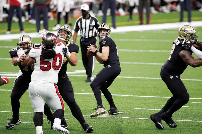 New Orleans Saints quarterback Drew Brees (9) looks to pass while playing against the Tampa Bay Buccaneers during an NFL football game, Sunday, Sept. 13, 2020, in New Orleans. 