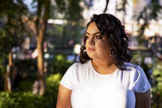 Oct. 1 mass shooting survivor, Ivette Cerna, poses for a photo during a visit to the Las Vegas Community Healing Garden, Monday, Sept. 28, 2020.