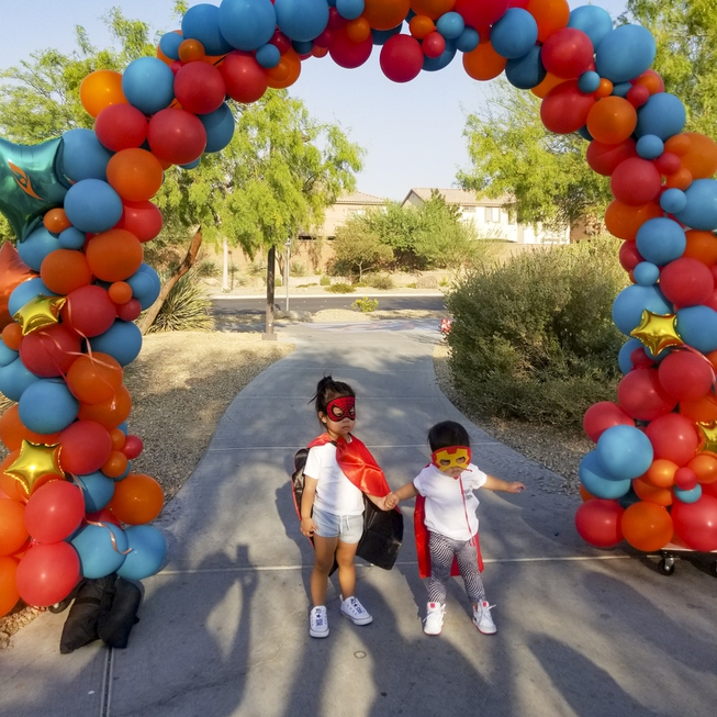 Candlelighters Superhero 5K Superhero Ambassador Logan, 2, (right