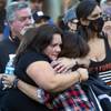 Shooting survivor Connie Long, left, and Debby Allen, mother of shooting victim Christopher Roybal, embrace during a 1 October Sunrise Remembrance ceremony at the Clark County Government Center amphitheater Thursday, Oct 1, 2020.
