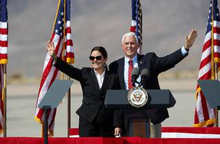 U.S. Vice President Mike Pence and his wife Karen wave to supporters during a campaign stop at the Boulder City Municipal Airport Thursday, Oct. 8, 2020.
