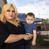 Yanneth Romero, a Mandalay Bay housekeeper who hasn't been called back to work, poses with her son Octavio in the backyard of her rental home in North Las Vegas Friday, Oct. 9, 2020. Her husband is also out of work and his unemployment claim is stuck in the system, she said.
