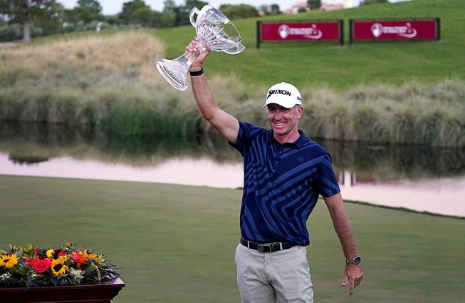 Martin Laird celebrates with the trophy after winning the Shriners ...