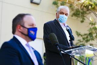 Nevada Governor Steve Sisolak, right, discusses details of a new Pandemic Emergency Technical Support (PETS) small business grant at the Latin Chamber of Commerce, downtown, Wednesday, Oct. 14, 2020.