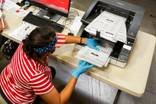 Election Department Begins Scanning Mail-In Ballots
