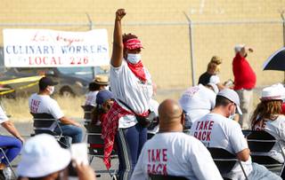Union member Diana Thomas cheers during a canvassing rally at the Culinary Workers Union, Local 226, headquarters Wednesday, Oct. 21, 2020.