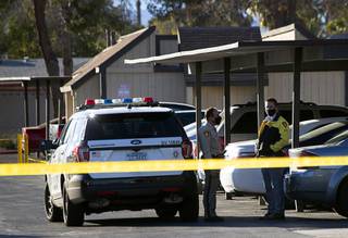 Metro Police are shown near the scene of a suspected homicide in the City View Apartments near Desert Inn Road and Arville Street Tuesday, Oct. 27, 2020.