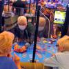 See-through barriers separate gamblers and a dealer at a card table at the Hard Rock casino in Atlantic City, N.J., on July 2, 2020, the first day it reopened after being closed for four months due to the coronavirus outbreak.