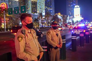 Metro Police officers maintain a presence near the Polo Towers on the Las Vegas Strip Saturday, Oct. 24, 2020. 