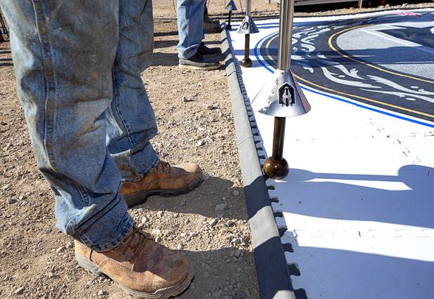 Construction workers hold ceremonial lances during the celebration of a construction milestone at the Henderson Events Center construction site Wednesday, Oct. 28, 2020. The multi-purpose, 6,000-seat indoor events center will be the arena for the Henderson Silver Knights.