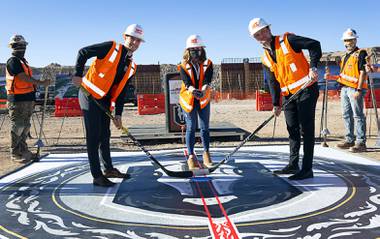 Future Silver Knights players Reid Duke and Gage Quinney stood where their center ice will soon be and took a ceremonial puck drop from Henderson Mayor Debra March. They were at the heart of the construction site for the Henderson Event Center, the future home of the city’s ...