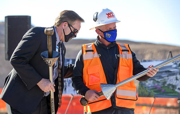 Henderson City Manager Richard Derrick, left, and Vegas Golden Knights President Kerry Bubolz look over ceremonial lances during the celebration of a construction milestone at the Henderson Events Center construction site Wednesday, Oct. 28, 2020. The multi-purpose, 6,000-seat indoor events center will be the arena for the Henderson Silver Knights.