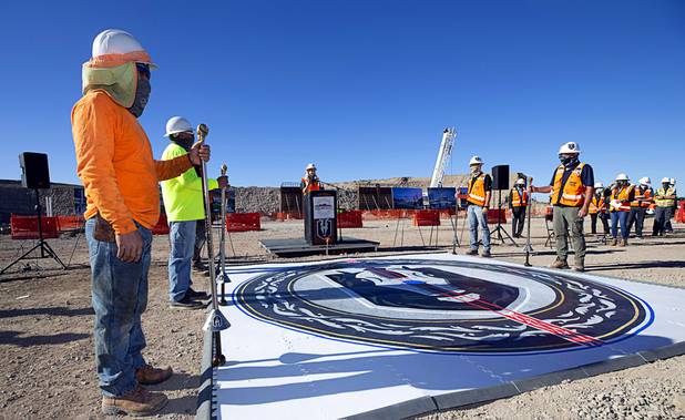 Construction workers hold ceremonial lances during the celebration of a construction milestone at the site of the Henderson Events Center Wednesday, Oct. 28, 2020. The multi-purpose 6,000-seat indoor events center will be the arena for the Henderson Silver Knights.