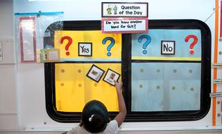 Students post their names after correct answers in a City of Las Vegas pre-kindergarten mobile classroom Wednesday, Oct. 28, 2020. The city uses the mobile pre-K classrooms to provide low-income pre-schoolers with a high-quality pre-school experience.