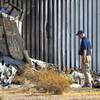 An investigator looks over the wreckage of a small plane after a crash near Pebble and Valley View Boulevard Thursday. Oct. 29, 2020.