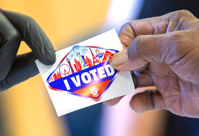 A voter takes an 