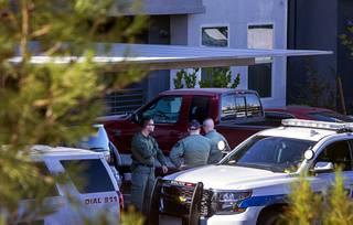 Henderson Police officers are shown at the scene of a fatal shooting in an apartment complex near Wigwam Parkway and Stephanie Street in Henderson Tuesday, Nov. 3, 2020.