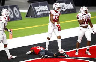 UNLV Rebels wide receiver Kyle Williams (1) is slow to get up after failing to make a reception in the end zone during the second half of a game against the Fresno State Bulldogs at Allegiant Stadium Saturday, Nov. 7, 2020. Bulldogs from left: Andrew Wright (31), Justin Houston (13), and Malachi Langley (35).