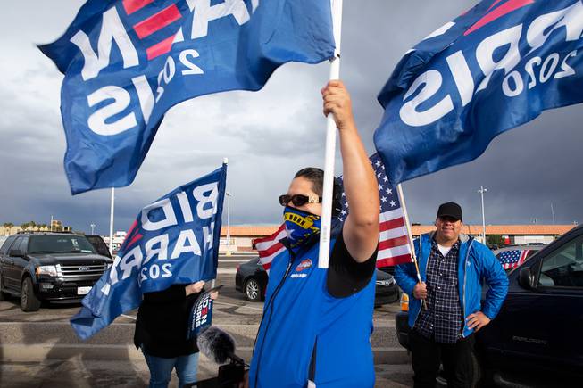Hernan Hernandez-Vela waves a Biden Harris 2020 flag in celebration of Joe Biden winning the 2020 Presidential Election, Saturday Nov. 7, 2020.