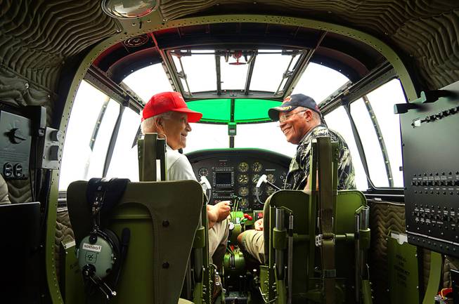 Ron McGee and his father Charles McGee are shown in cockpit of B-17 in Oshkosh, Wisc. in 2012.