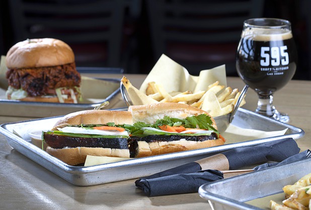 A Nashville-style Hot Chicken Sandwich, left, and a Pork Belly Banh Mi are shown at 595 Craft and Kitchen at Rainbow Boulevard and Tropicana Avenue Wednesday, Nov. 11, 2020.