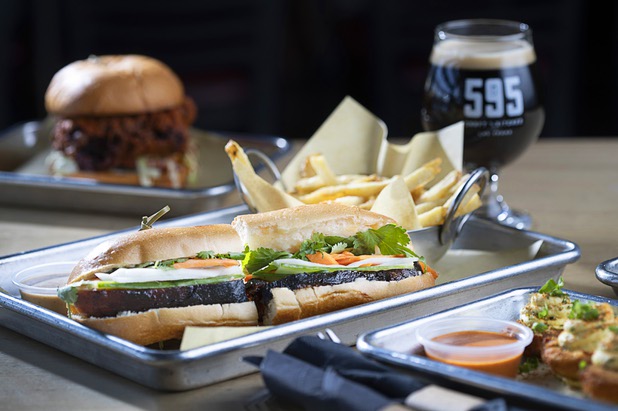 A Nashville-style Hot Chicken Sandwich, left, and a Pork Belly Banh Mi are shown at 595 Craft and Kitchen at Rainbow Boulevard and Tropicana Avenue Wednesday, Nov. 11, 2020.