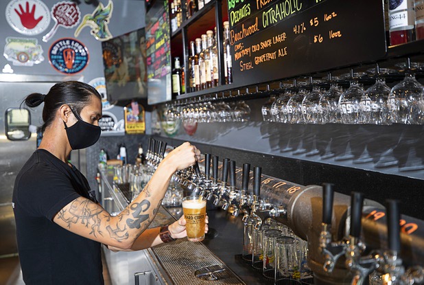 Erik Morales works the bar at 595 Craft and Kitchen at Rainbow Boulevard and Tropicana Avenue Wednesday, Nov. 11, 2020.