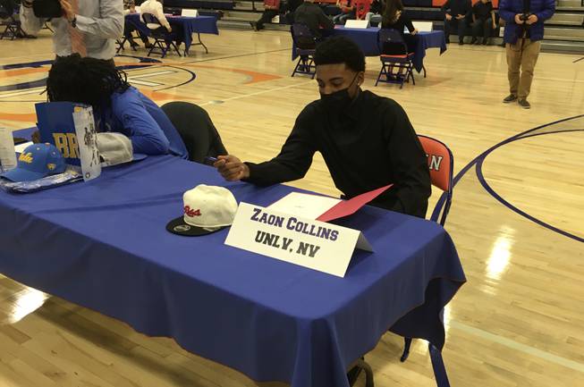 Bishop Gorman basketball player Zaon Collins signs his letter of intent to UNLV on Thursday, Nov. 12, 2020.