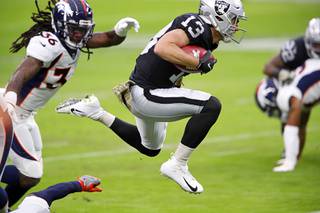 Las Vegas Raiders wide receiver Hunter Renfrow (13) breaks a tackle attempt during the first half of a game against the Denver Broncos at Allegiant Stadium Sunday, Nov. 15, 2020.